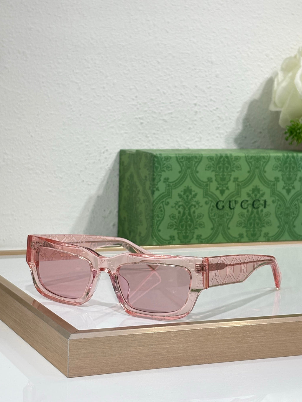 Gucci sunglasses with pink translucent oversized frames and rose lenses
