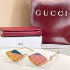 Gold-tone cat-eye sunglasses with burgundy lenses