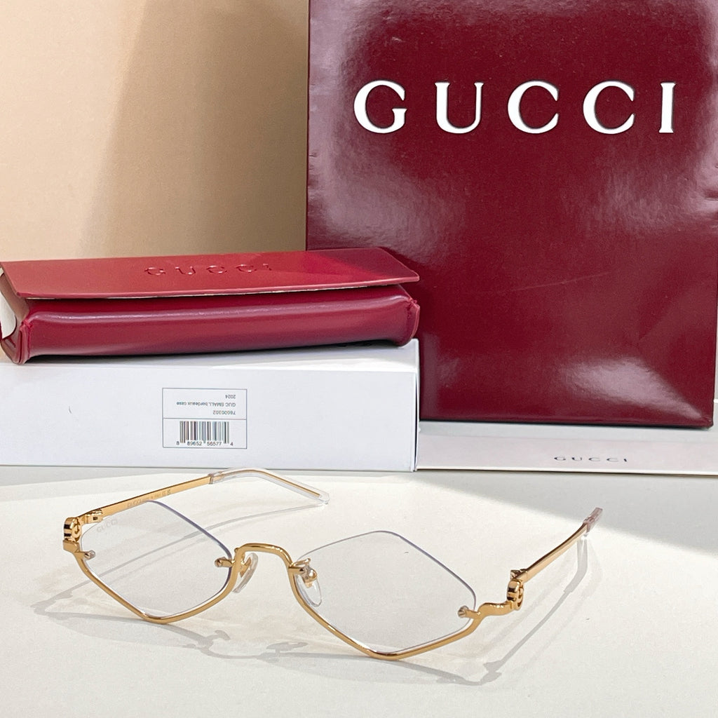 Gold-tone cat-eye sunglasses with clear lenses
