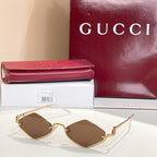 Gold-tone cat-eye sunglasses with dark brown lenses