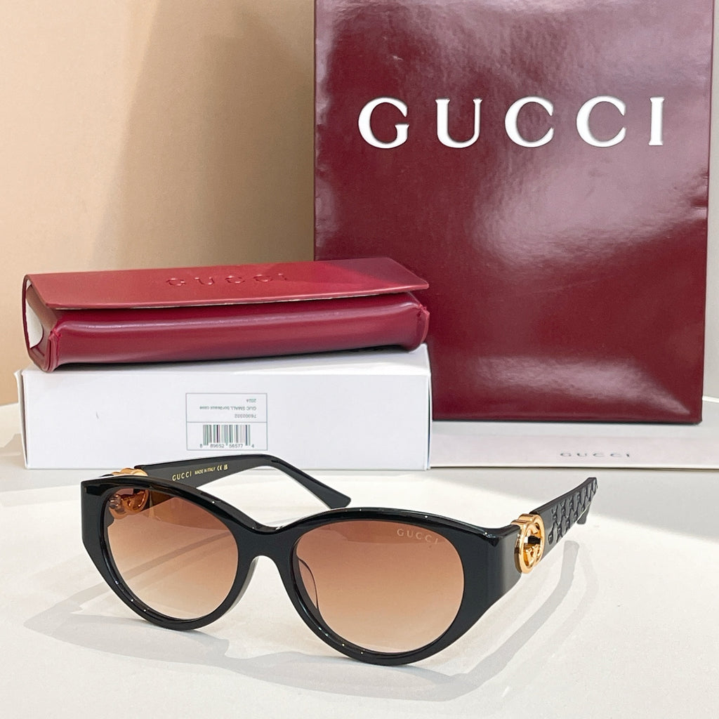 Gucci cat-eye sunglasses with dark tortoise frames and amber-brown lenses
