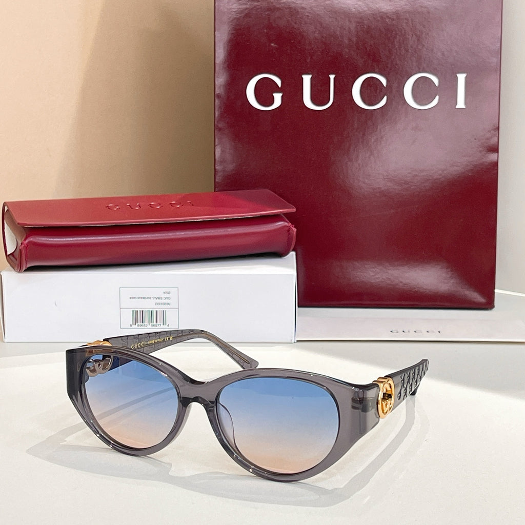 Gucci cat-eye sunglasses with dark tortoise frames and blue gradient lenses