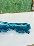 Close-up of blue glasses frames with dark lenses