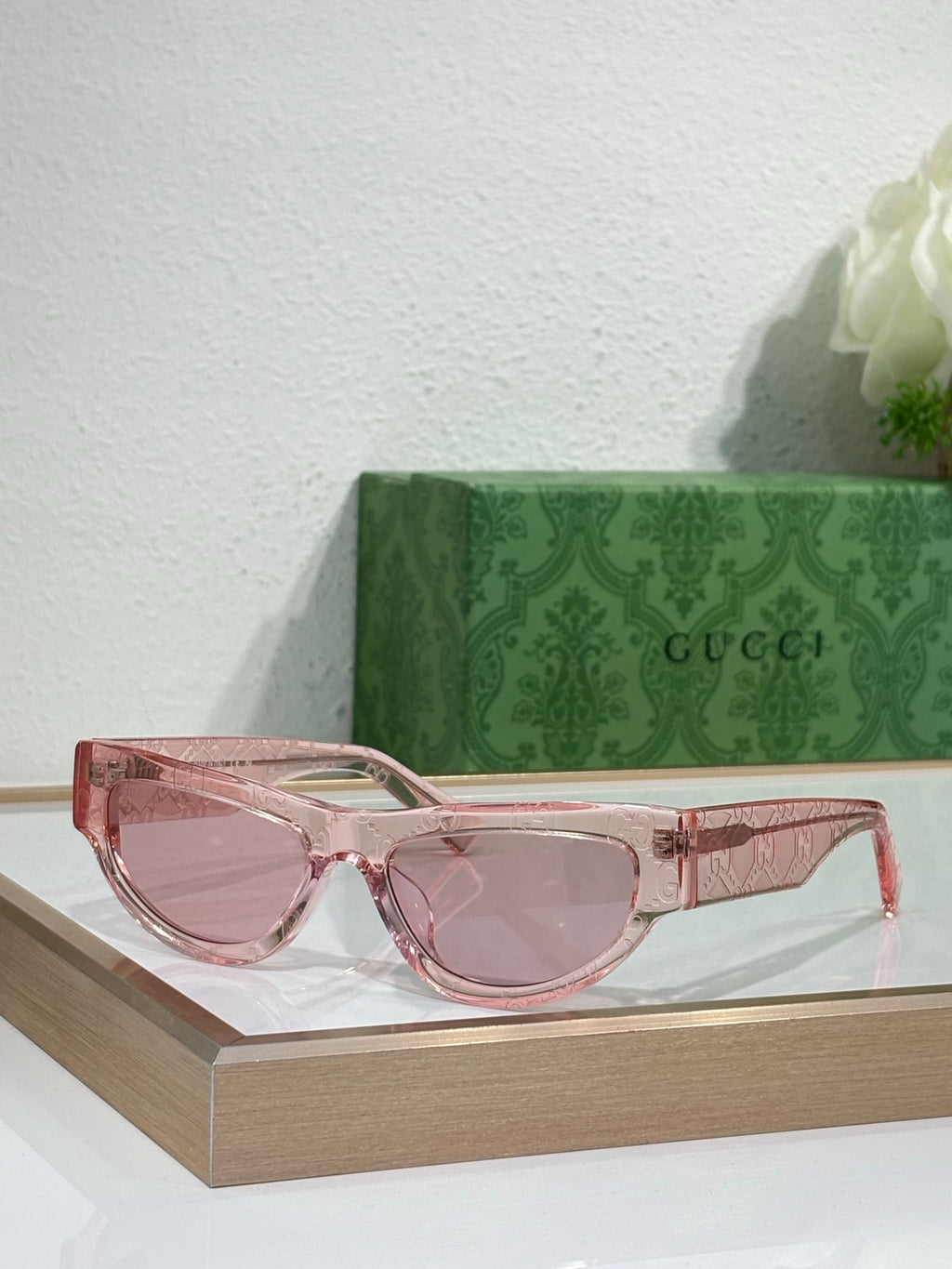 Glasses with pink transparent frames and tinted lenses