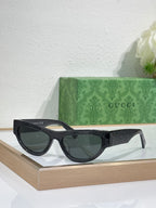 Glasses with black frames and dark tinted lenses