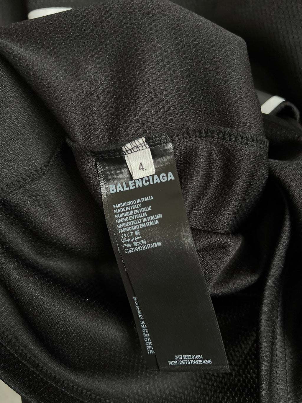 Balenciaga black T-shirt fabric with care label tag on inner seam