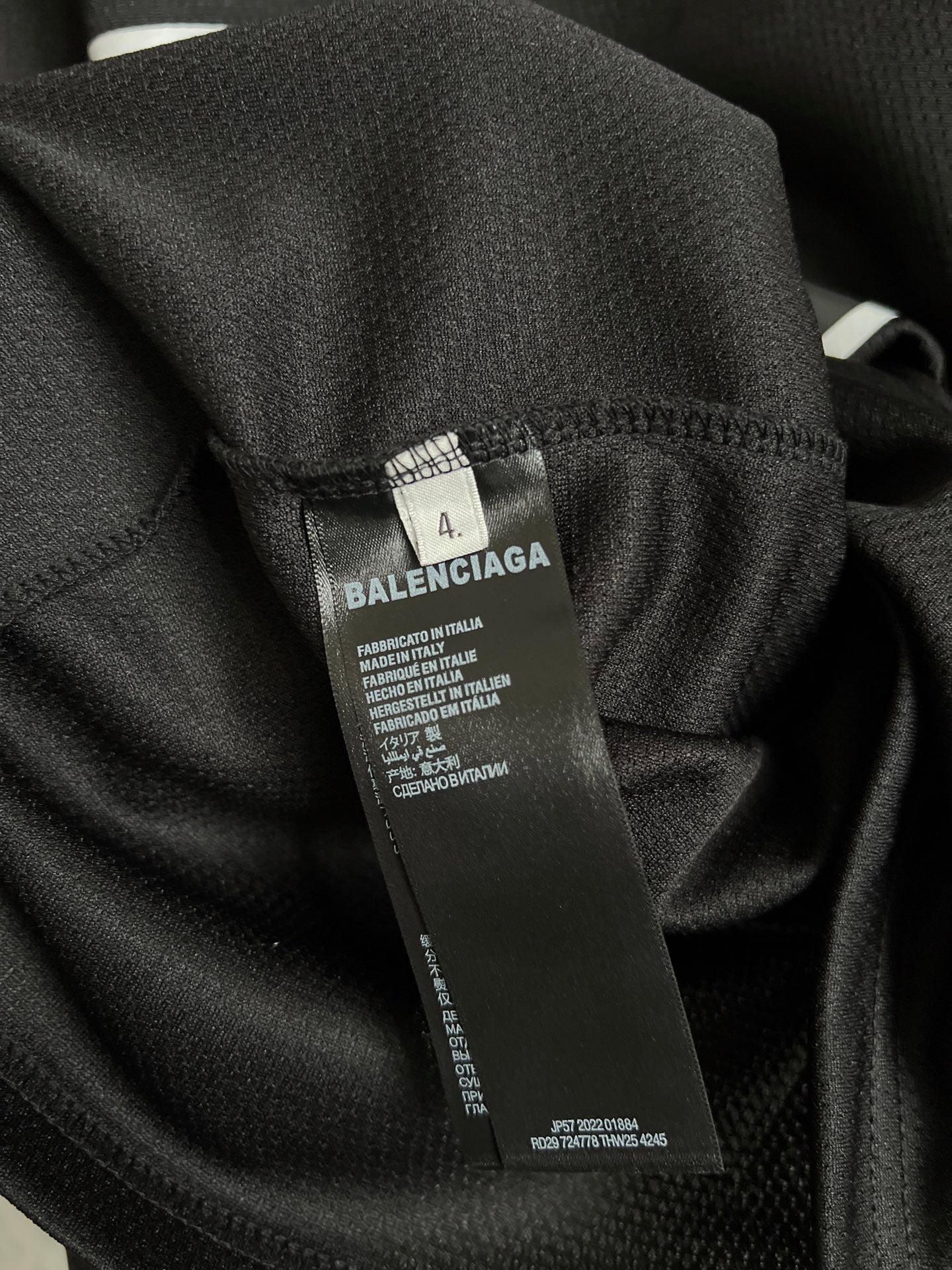 Balenciaga black T-shirt fabric with care label tag on inner seam