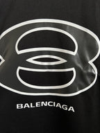Balenciaga black T-shirt close-up of white logo print and BALENCIAGA text