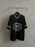 Balenciaga black short-sleeve T-shirt with large white logo graphic and V-neck collar