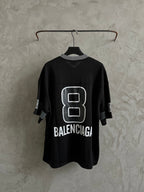 Balenciaga black short-sleeve T-shirt on hanger with white "8" logo