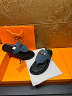Hermes sandals set with blue suede straps and silver buckles on black slide soles