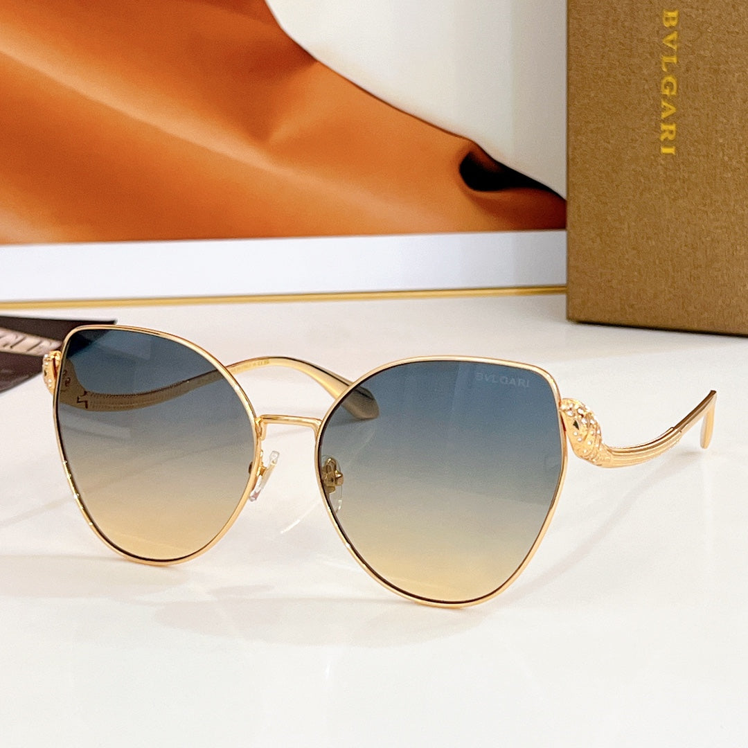 Bvlgari round sunglasses, gold frame with blue gradient lenses and jeweled temple detail