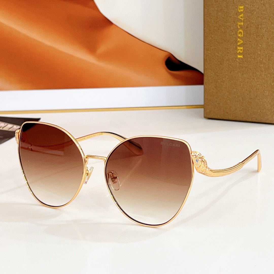 Bvlgari round sunglasses, gold frame with brown gradient lenses and jeweled temple detail