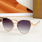 Bvlgari round sunglasses, gold frame with dark purple gradient lenses and jeweled temple detail
