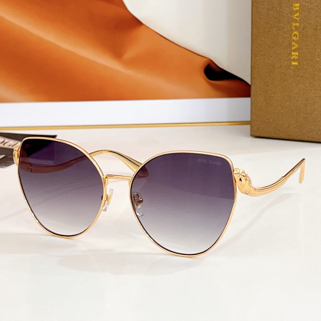 Bvlgari round sunglasses, gold frame with dark purple gradient lenses and jeweled temple detail