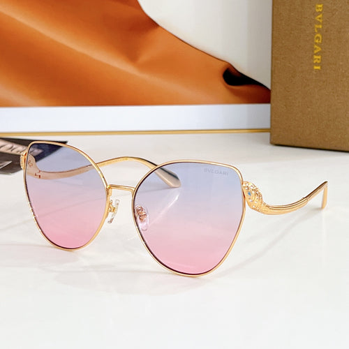 Bvlgari round sunglasses, gold frame with pink-to-clear gradient lenses and jeweled temple detail
