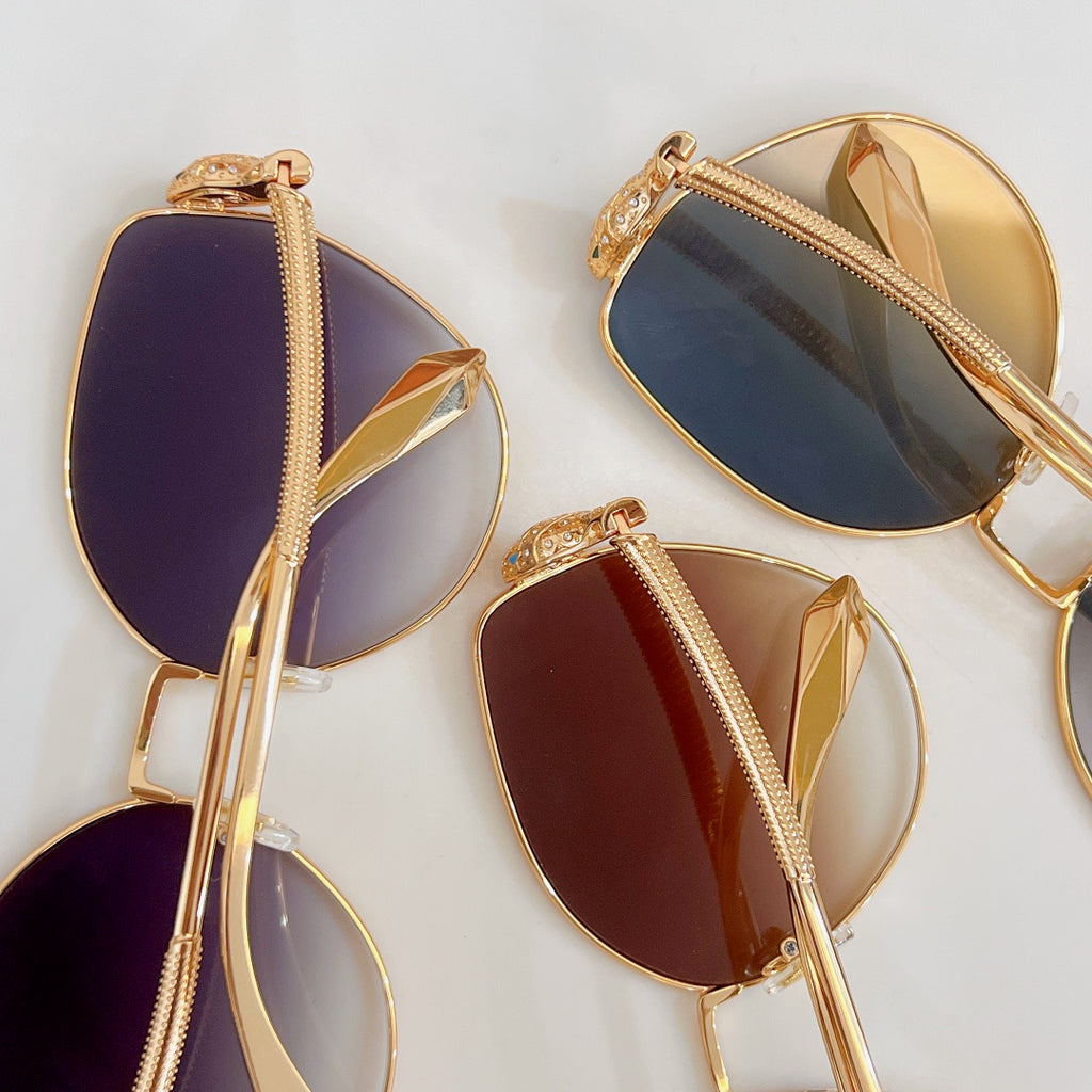 Bvlgari sunglasses assortment with gold frames and colored gradient lenses in purple, burgundy, blue