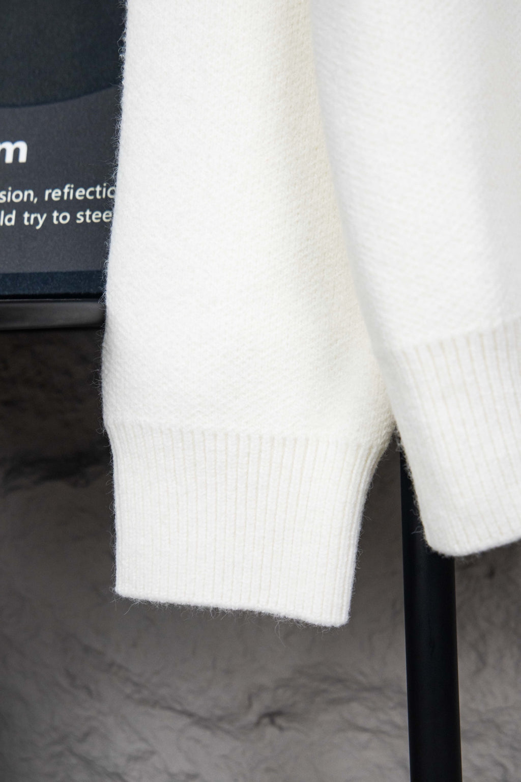 White ribbed knit cuffs on long-sleeve sweater