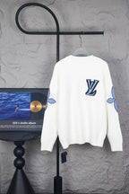 White long-sleeve knit sweater with large blue LV logo on back
