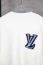 White knit sweater back with blue LV logo emblem