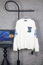 White long-sleeve knit sweater with blue LV logo at chest and sleeve