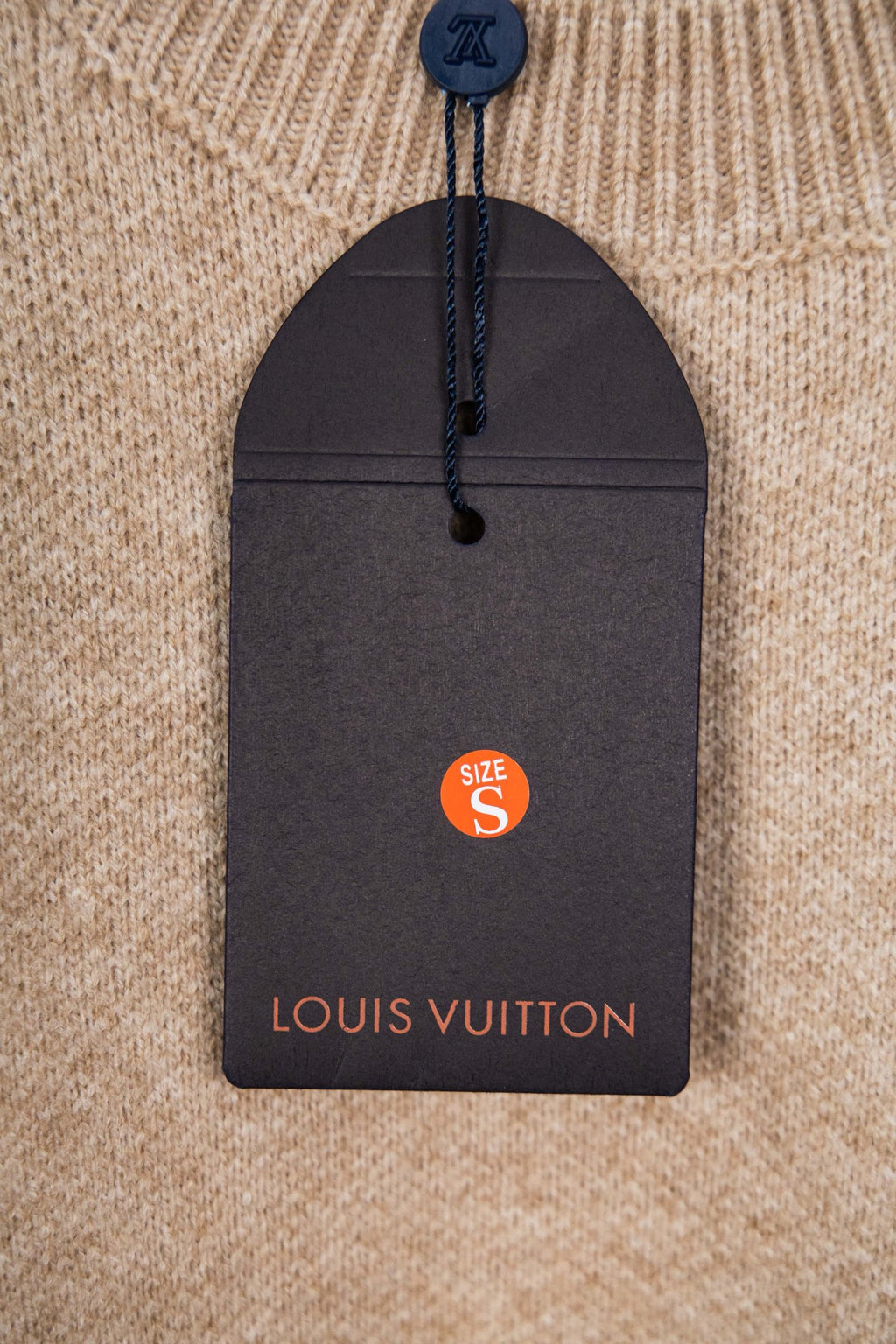 Beige knit sweater size S tag with Louis Vuitton branding