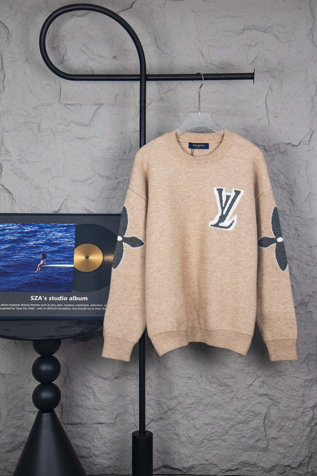 Beige knit sweater with large LV logo on front, crew neck, long sleeves