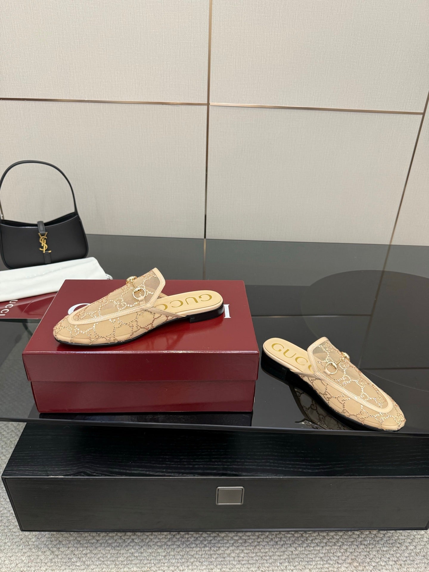 Gucci women's loafers, beige GG pattern mule with gold horsebit, angled view