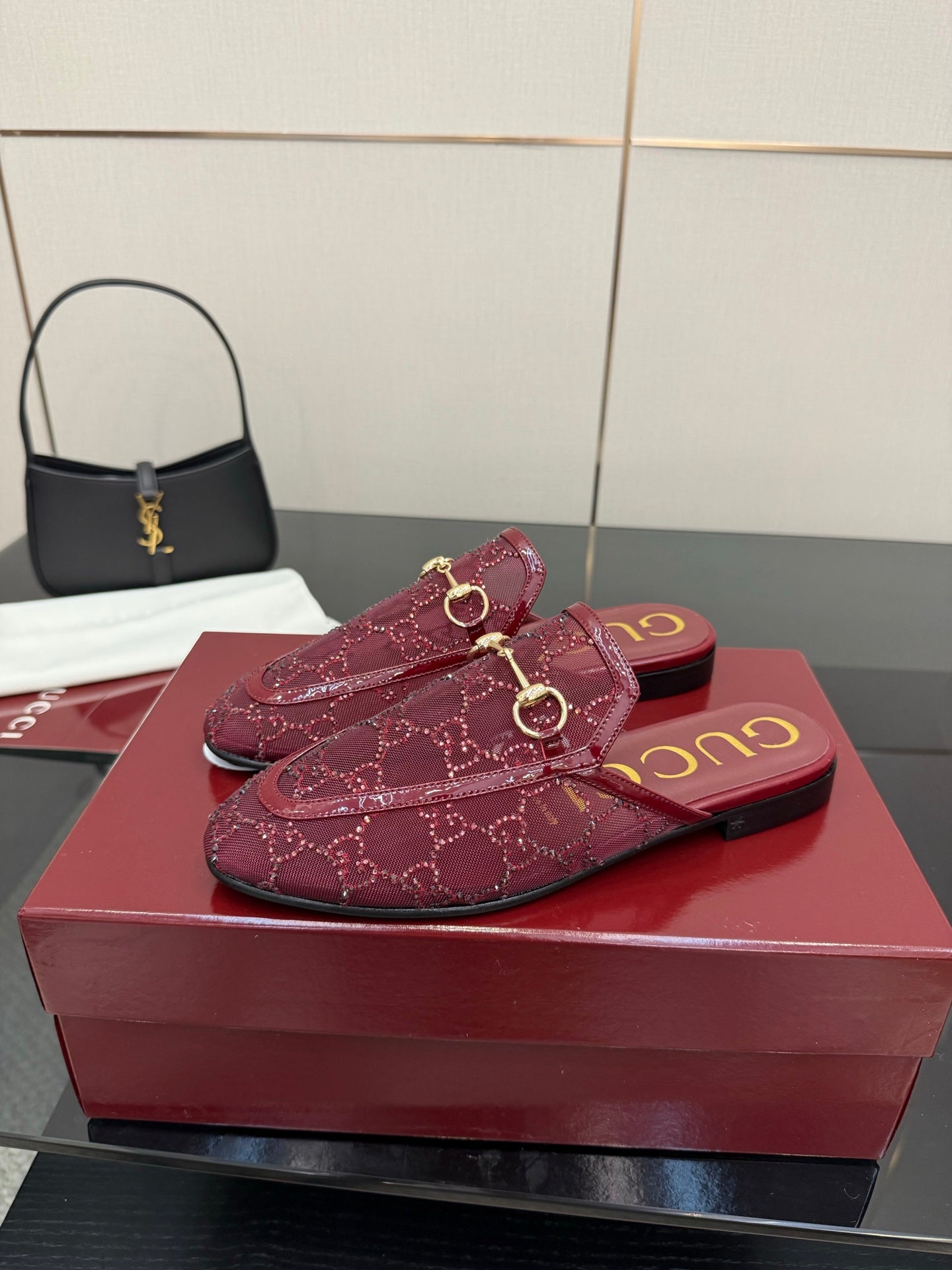 Gucci women's burgundy loafers with gold horsebit, top view