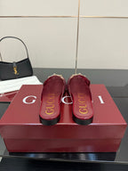 Gucci women's burgundy loafers, heel and insole view with gold trim