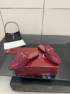 Gucci women's burgundy horsebit loafers, side view with textured monogram