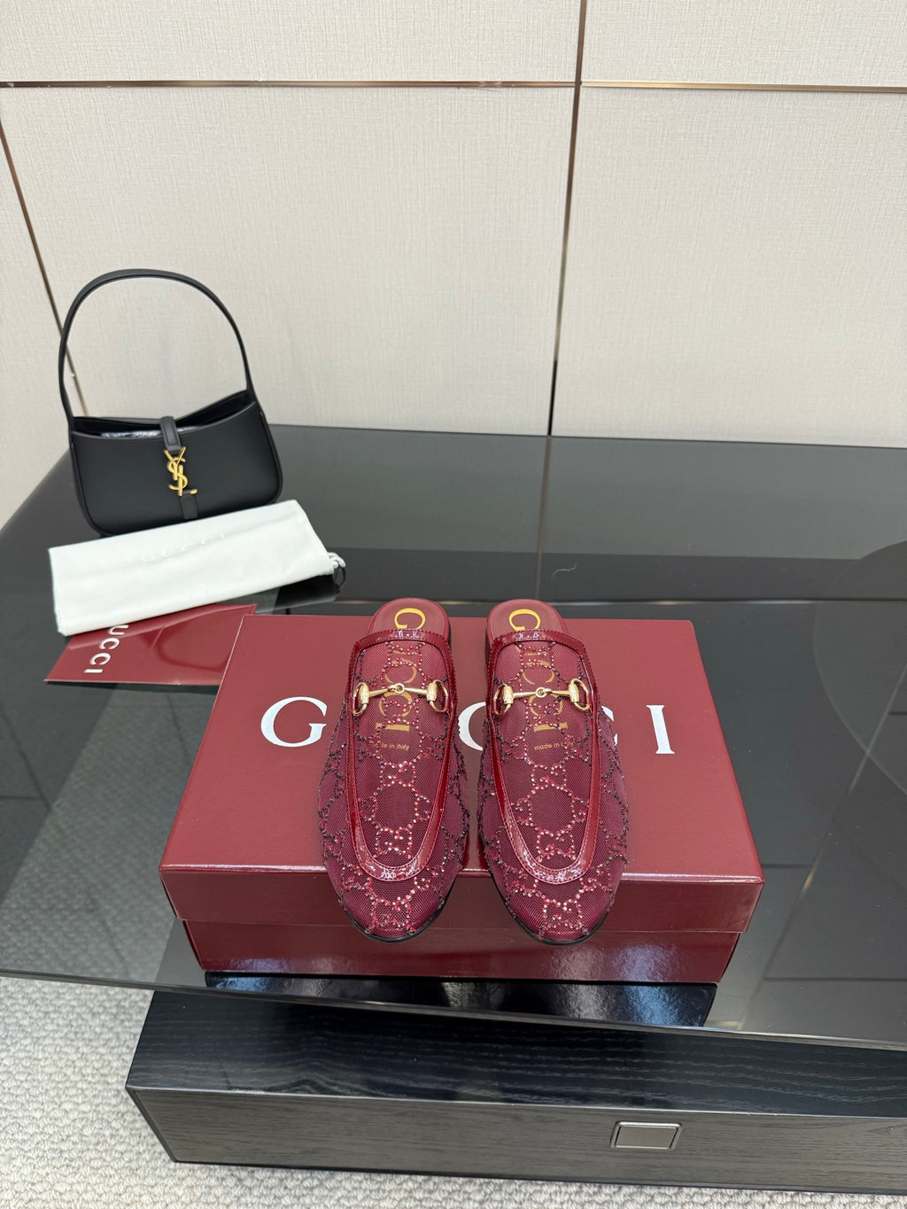 Gucci women's burgundy loafers with gold horsebit detail and monogram pattern