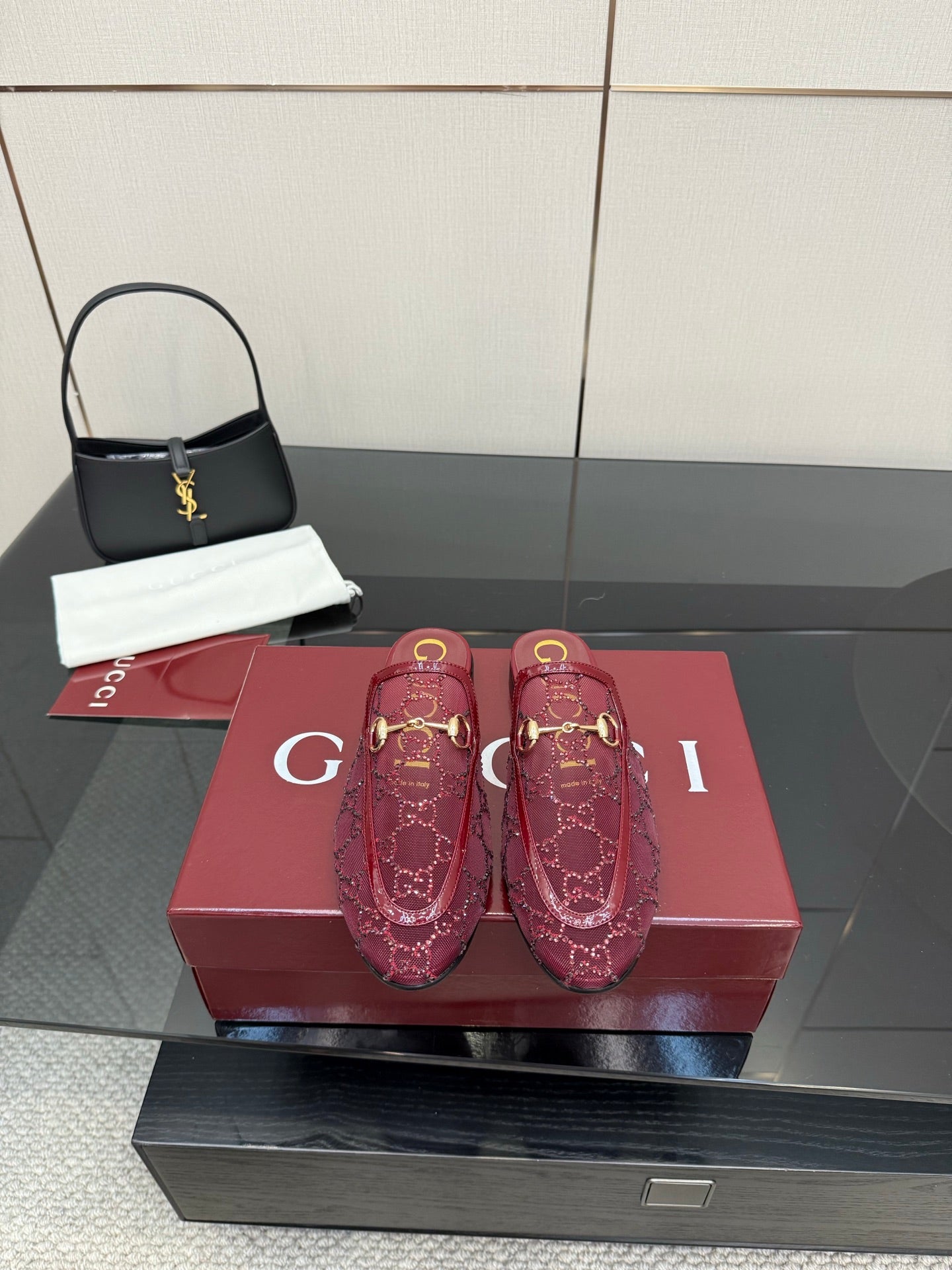 Gucci women's burgundy loafers with gold horsebit detail and monogram pattern