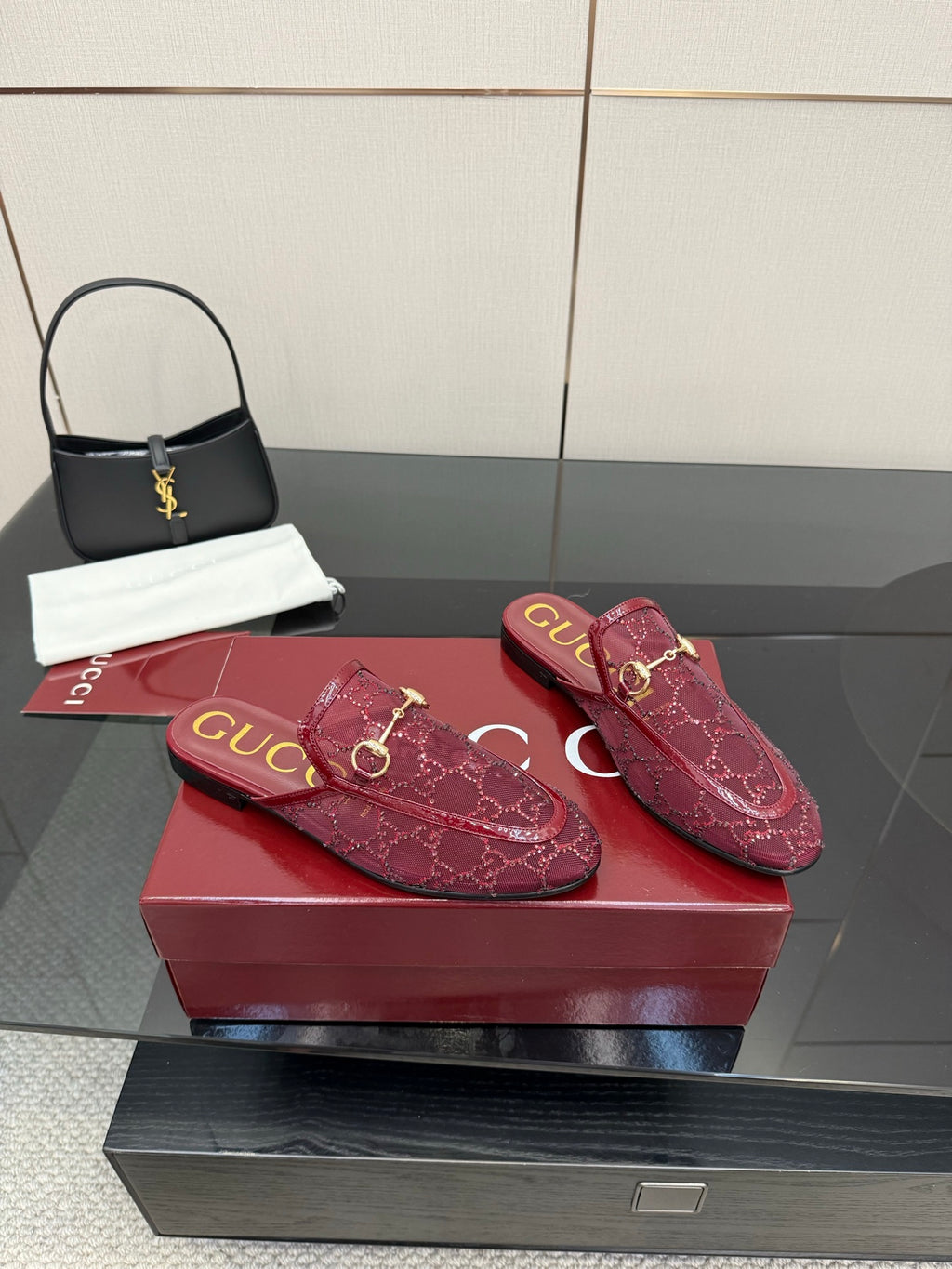 Pair of Gucci women's burgundy monogram loafers with gold horsebit hardware