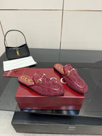 Pair of Gucci women's burgundy monogram loafers with gold horsebit hardware
