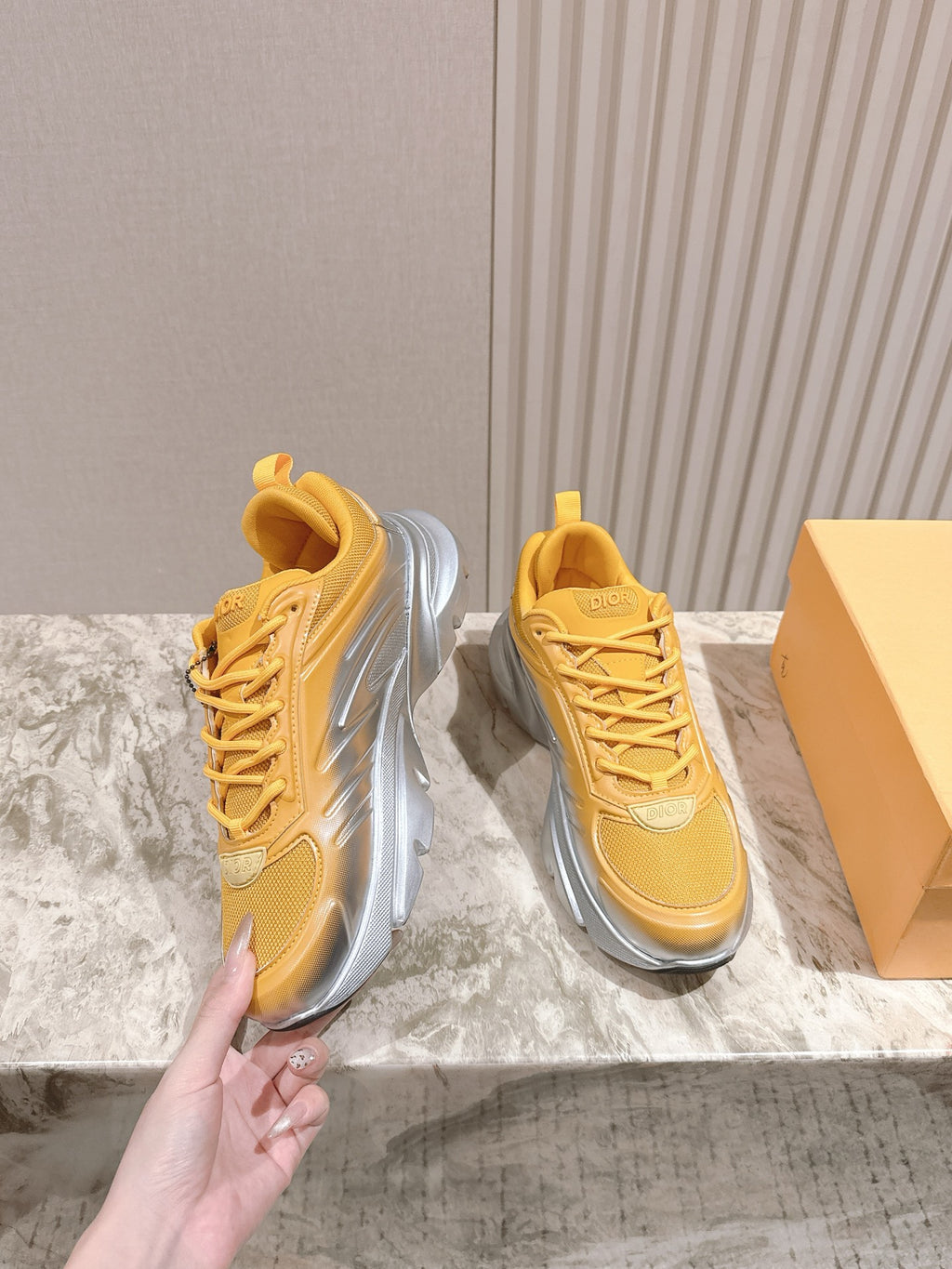 Dior unisex sneakers, yellow lace-up style with layered gray sole and side detail