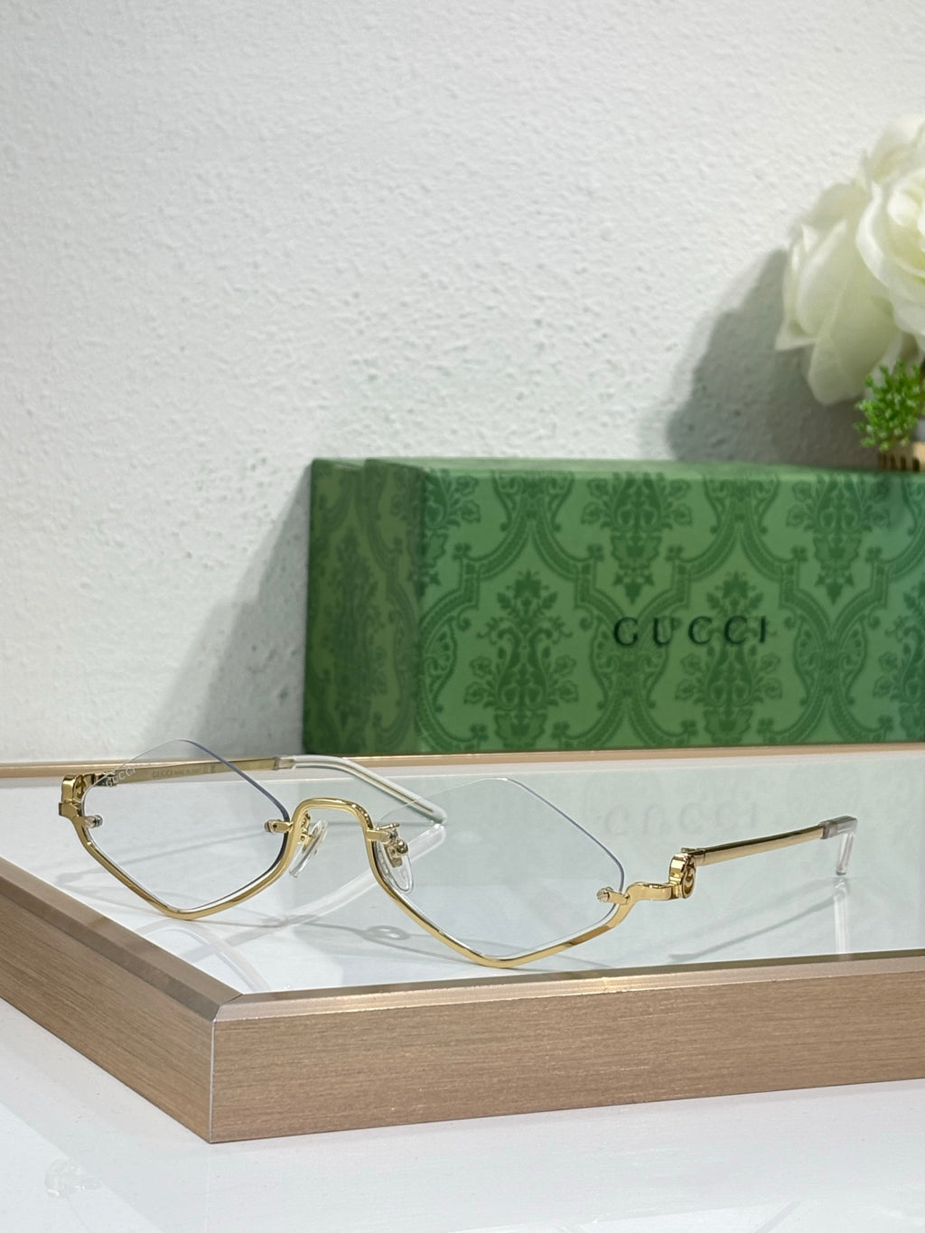 Gucci glasses with gold-tone cat-eye frames and clear lenses