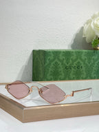 Gucci glasses with rose-gold cat-eye frames and pink-tinted lenses