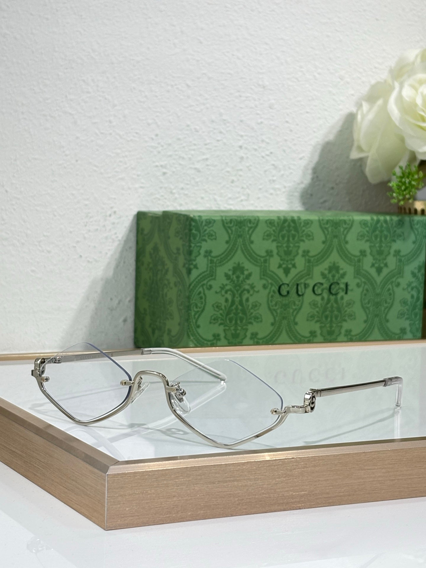 Gucci glasses with silver-tone cat-eye frames and clear lenses