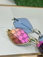 Gucci glasses with multicolor GG frames and blue lenses, gold-tone arms