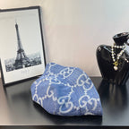 Gucci blue GG-pattern denim bucket cap, profile view with curved brim