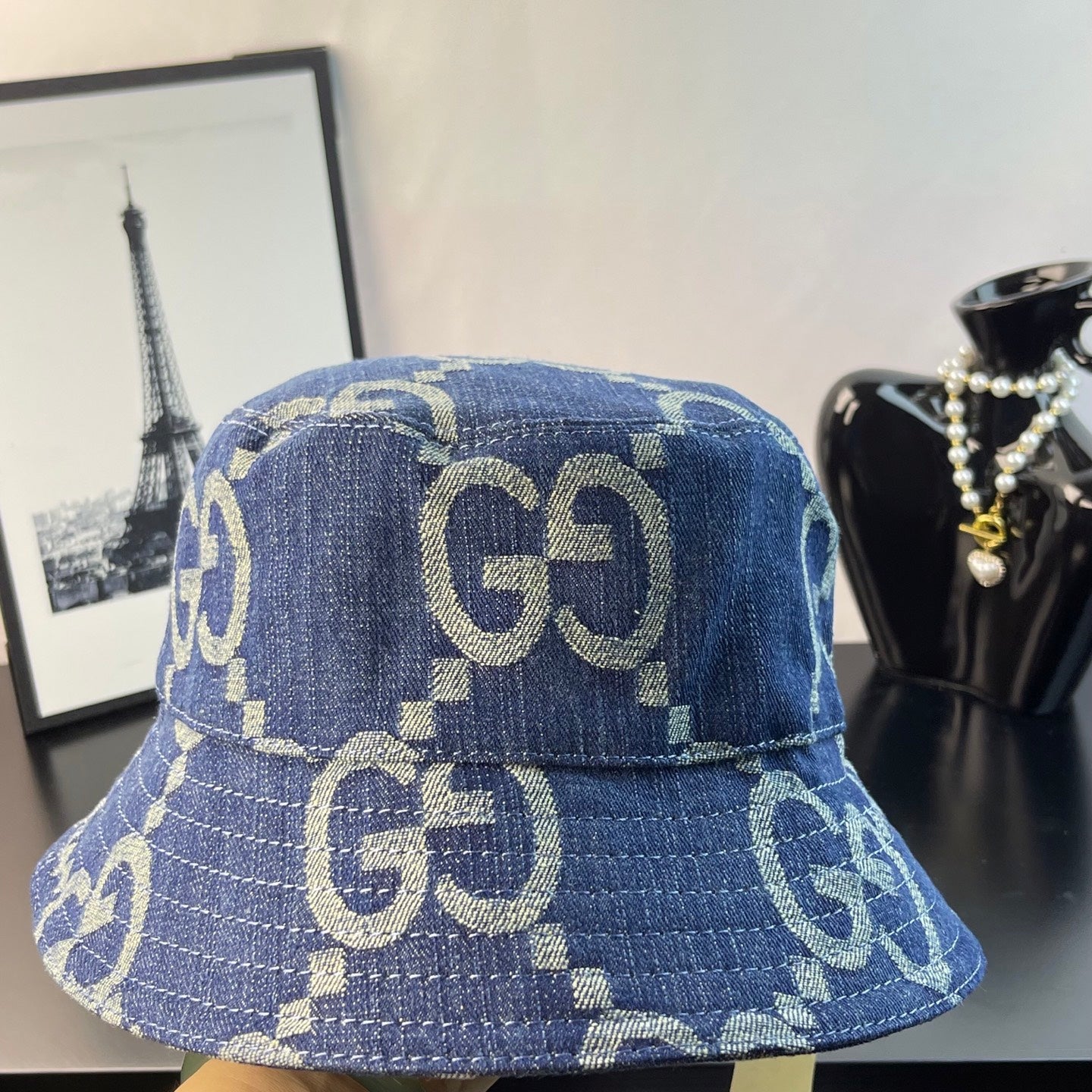 Gucci blue GG-pattern denim bucket cap, back view with stitched paneling