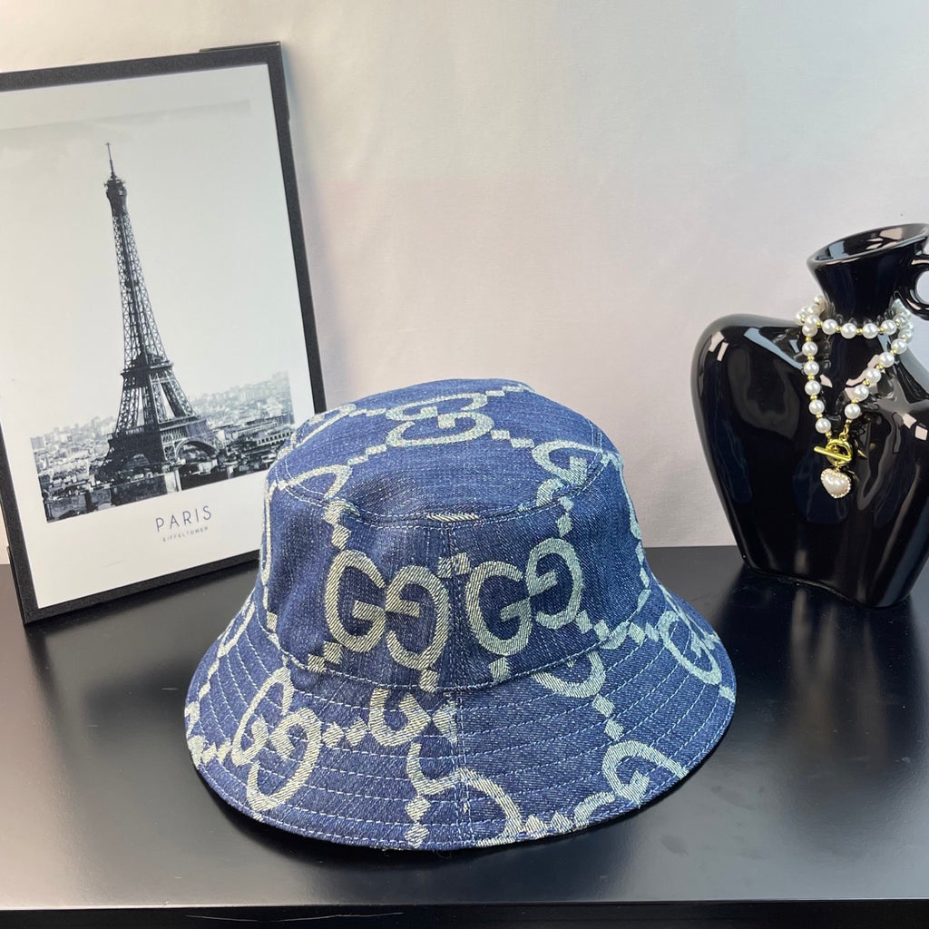 Gucci blue GG-pattern denim bucket cap, side view with curved brim