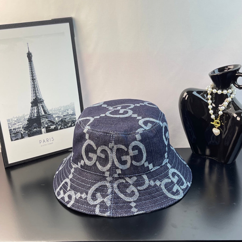 Gucci bucket hat in dark denim with white GG monogram logo pattern