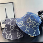 Pair of Gucci bucket caps in blue and dark navy denim with GG monogram pattern