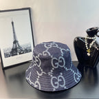 Gucci bucket cap in dark navy denim with white GG monogram pattern