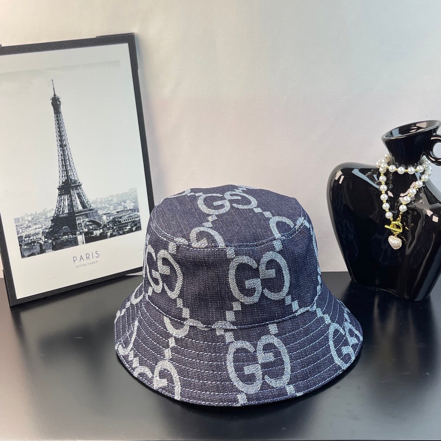 Gucci bucket cap in dark navy denim with white GG monogram pattern
