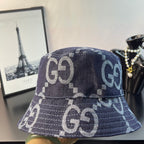 Gucci bucket cap in dark denim with white GG logo embroidery-style pattern