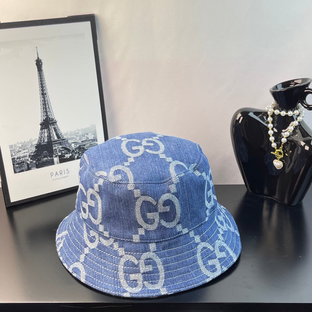 Gucci GG denim bucket hat in blue with repeating light monogram pattern