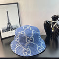 Gucci GG denim bucket hat in blue with repeating light monogram pattern